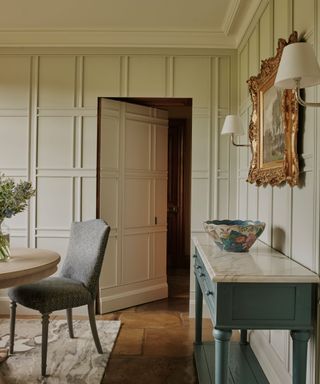 Georgian dining room with a jib door in the wall paneling