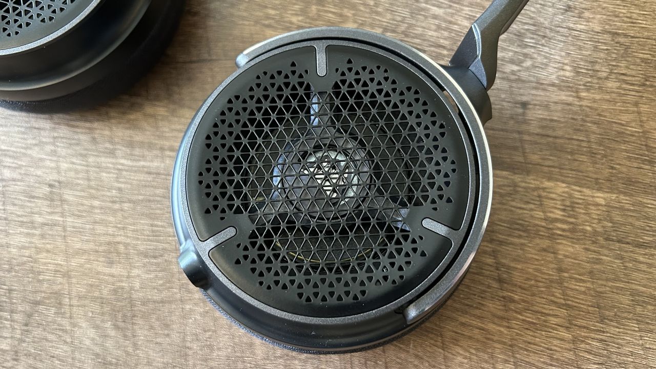 close up on cup grills of Corsair Virtuoso Pro showing open back design and logo