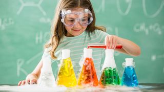 Best chemistry sets - Girl playing with chemistry set