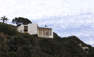 The use of engineering associated with bridges and industrial buildings lends itself well to this stern 'X' projecting out over a Spanish hilltop.