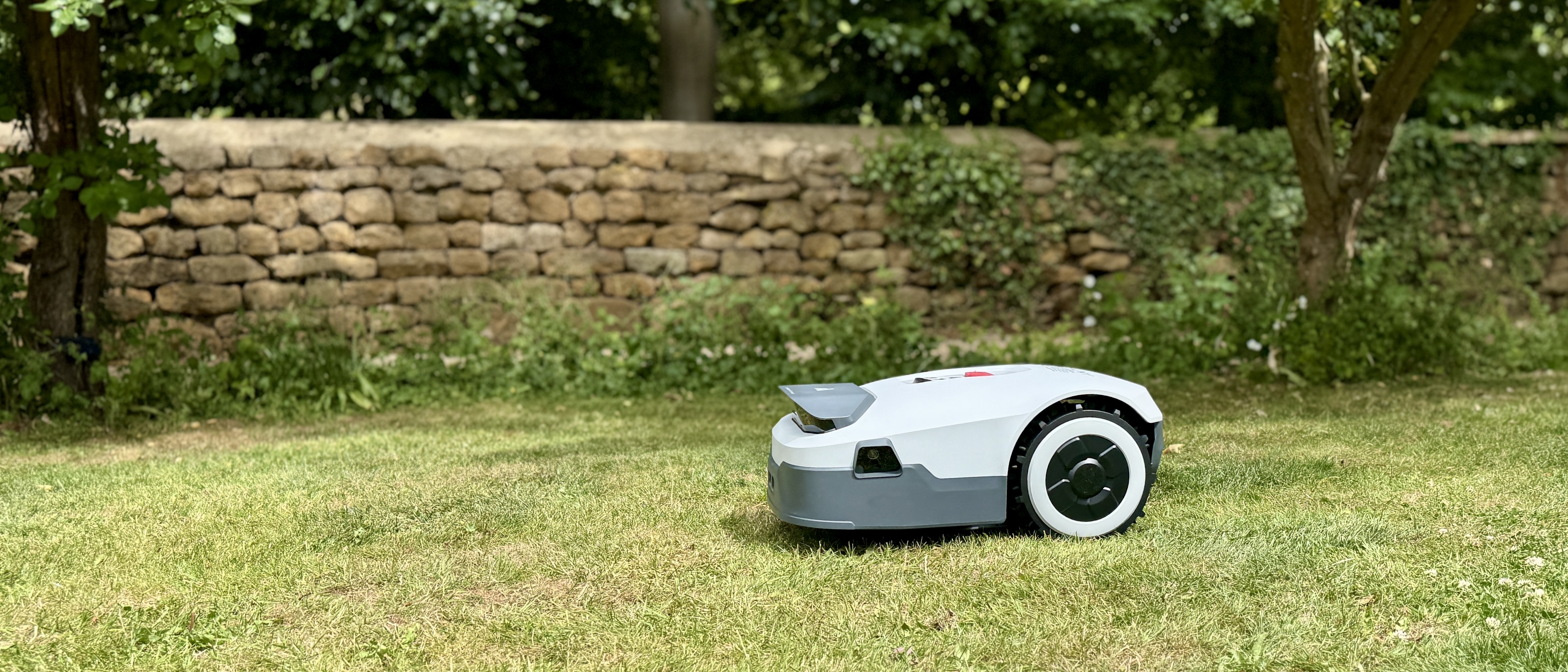Anthbot Genie 300 robot lawn mower in reviewer&#039;s yard