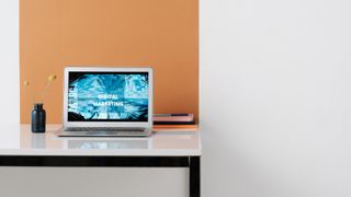 laptop on desk with digital marketing onscreen