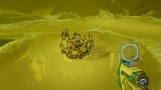 Subnautica 2 Axum Bacterial Culture: A player looking at an Axum Bacterial Culture on the ground inside a glowing green/yellow pool, while holding a Bioscanner.