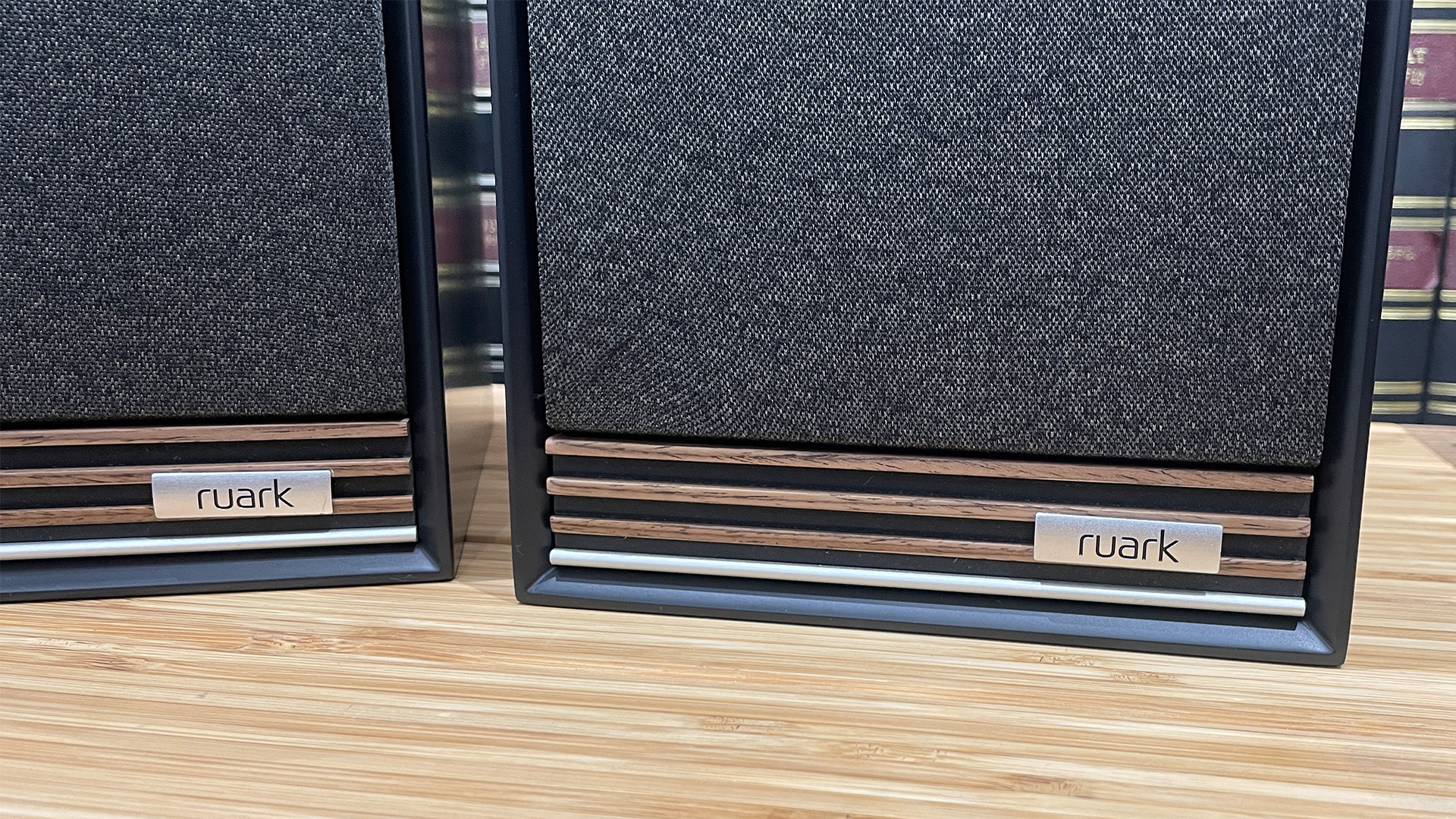 Ruark Audio Sabre-R speakers in black finish on wooden rack
