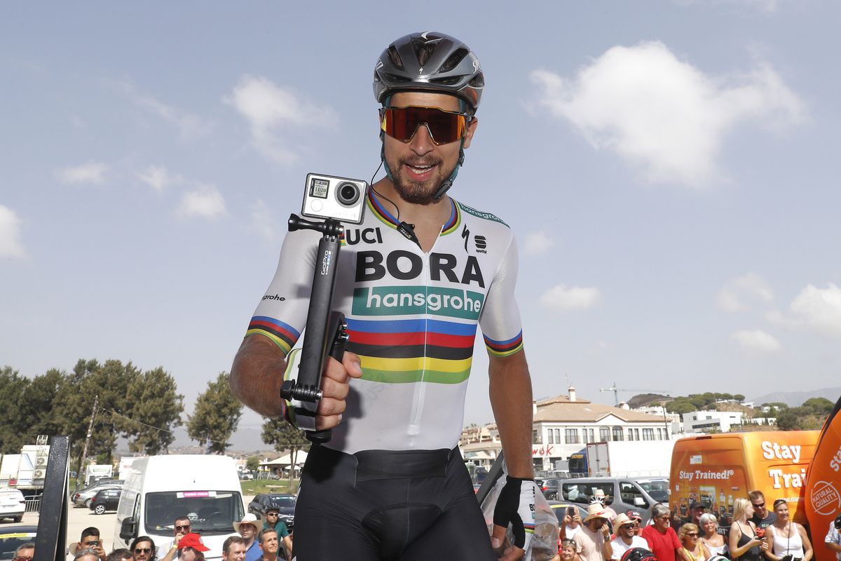 Peter Sagan videoing the sign on