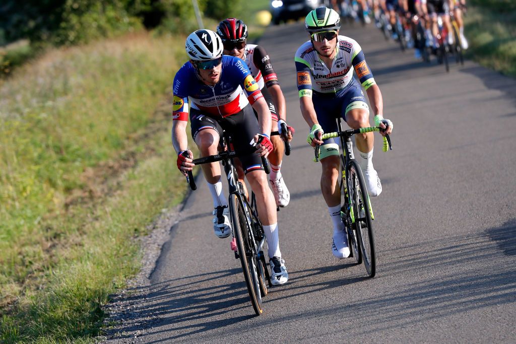 PRZEMYSL POLAND AUGUST 10 LR Rmi Cavagna of France and Team Deceuninck QuickStep Alessandro Covi of Italy and UAE Team Emirates Lorenzo Rota of Italy and Team Intermarch Wanty Gobert Matriaux in the Breakaway during the 78th Tour de Pologne 2021 Stage 2 a 201km stage from Zamo to Przemyl 341m TourdePologne TDP2021 UCIWT on August 10 2021 in Przemysl Poland Photo by Bas CzerwinskiGetty Images