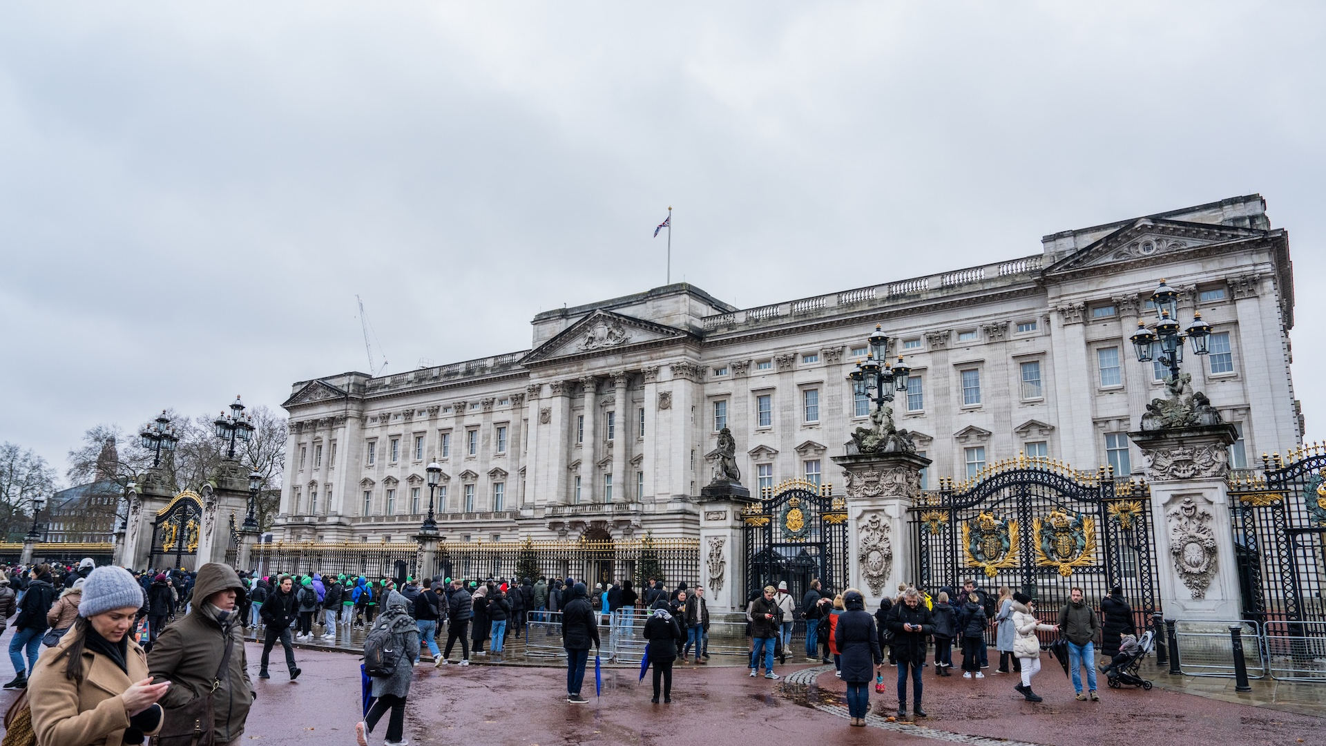 Visitors gather outside Buckingham Palace, in London