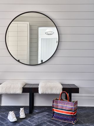mudroom ideas with shiplap walls and stone tile floors