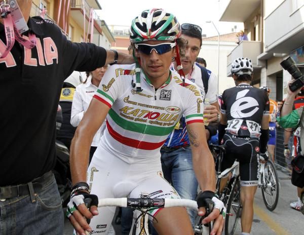 Filippo Pozzato (Katusha) is escorted to the podium