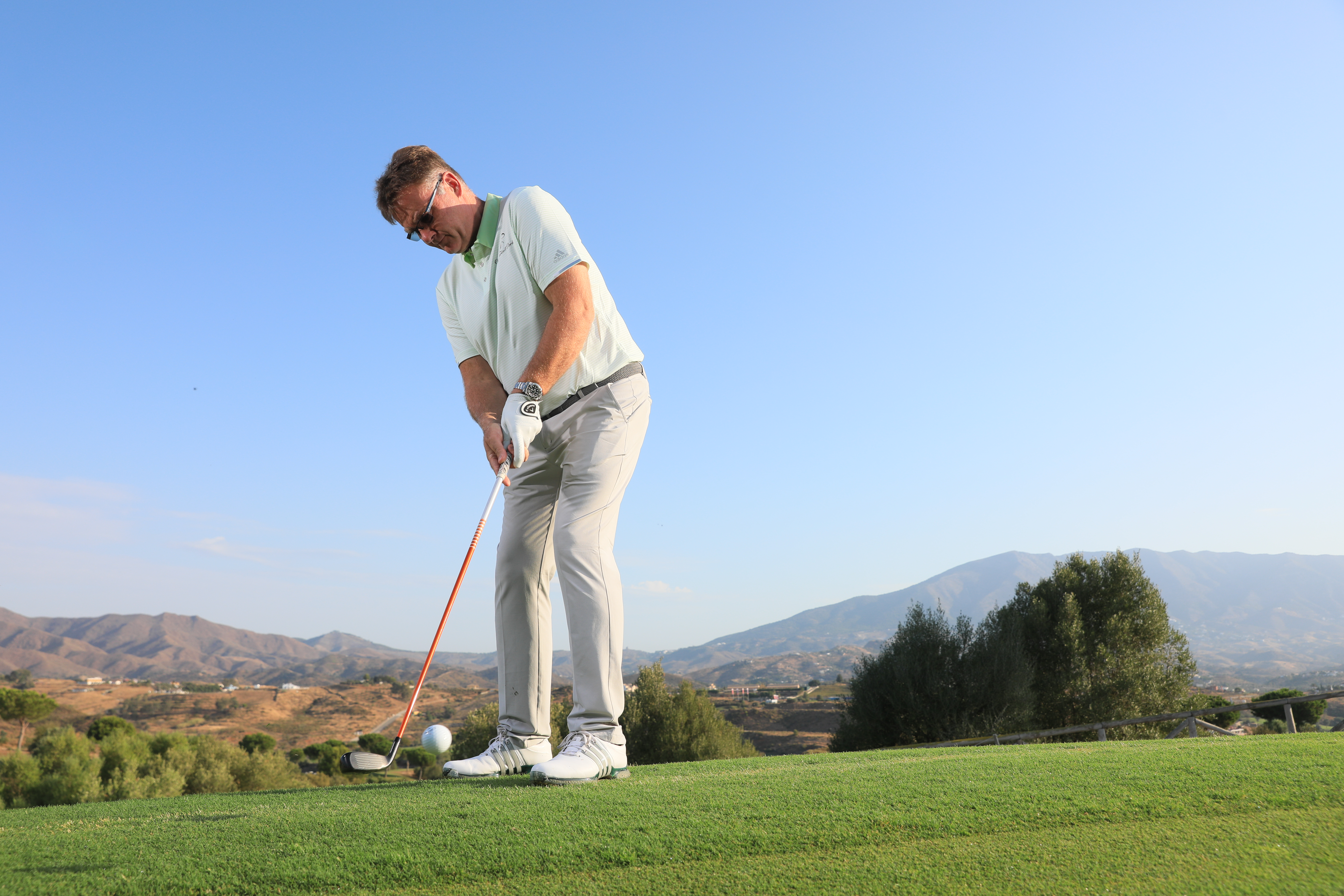 Playing a hybrid chip shot in golf
