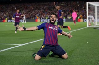 Luis Suarez celebrates scoring Barcelona's opener
