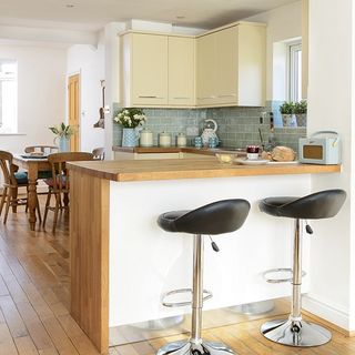 yellow and green kitchen with smart breakfast bar