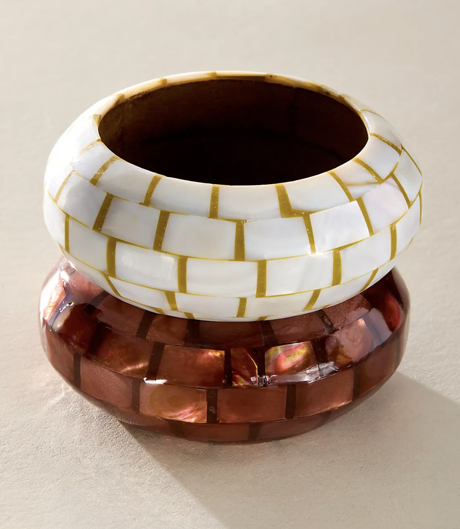 Free People bangles on a flat plain surface