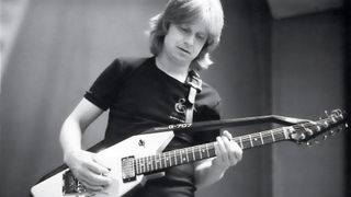 Swedish guitarist Janne Schaffer performs with a Roland G-707 guitar synthesizer controller in 1984.