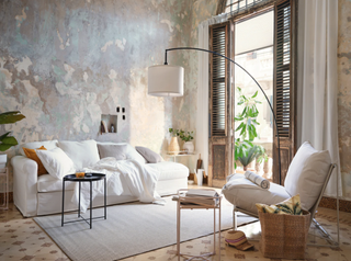 A modern living room idea by Ikea with shutter window treatment and distressed walls