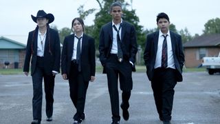 (L to R) Paulina Alexis as Willie, Devery Jacobs as Elora, D'Pharaoh Woon-A-Tai as Bear and Lane Factor as Cheese, walking in suits in Reservation Dogs