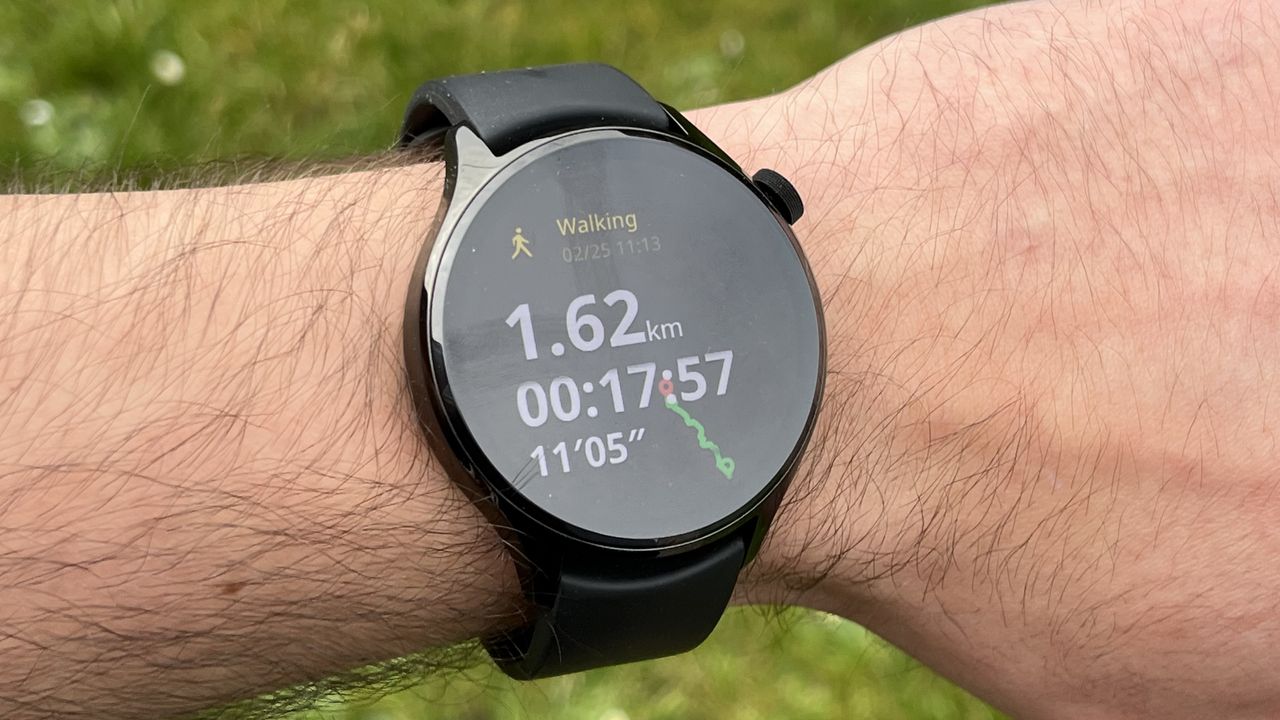 The Xiaomi Watch S1 Pro showing metrics from a workout, against a green background