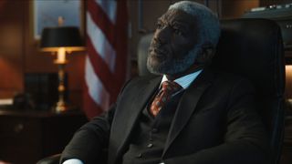 Walter Nyland sits in his desk chair in The Recruit season 2