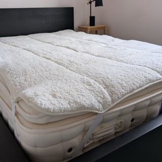 The Dunelm Teddy Mattress Topper being tested in a bedroom