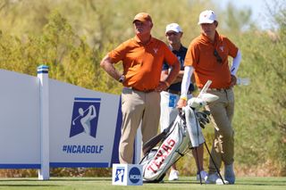 University of Texas men's golf head coach, John Fields stands with his hands on his hips (left)