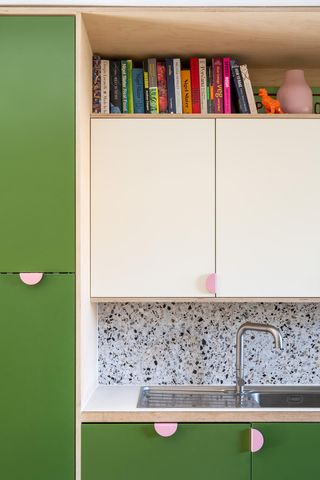 Green and white kitchen cabinets