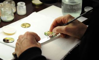 Demonstration of the intricate skill of enamelling in miniature