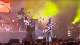 King Gizzard playing with a fan on stage