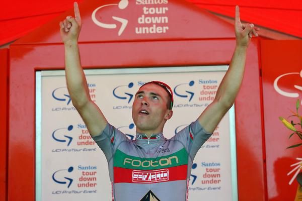 Manuel Cardoso (Footon-Servetto) acknowledges something higher from the podium.