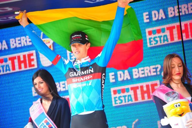 Stage 11 winner Ramunas Navardauskas (Garmin-Sharp) flies the Lithuania flag on the podium