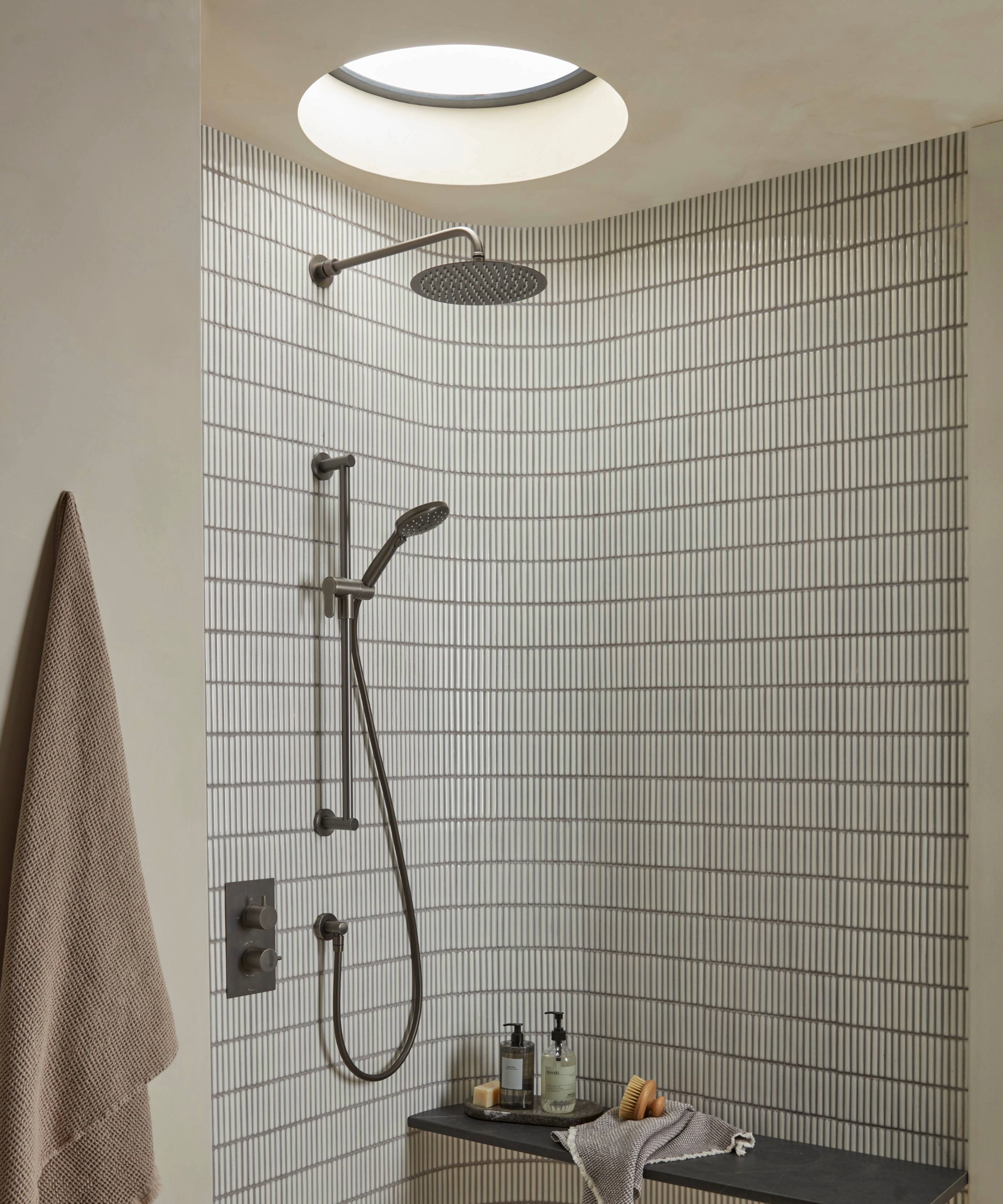 Shower enclosure with a bathroom window idea on the ceiling