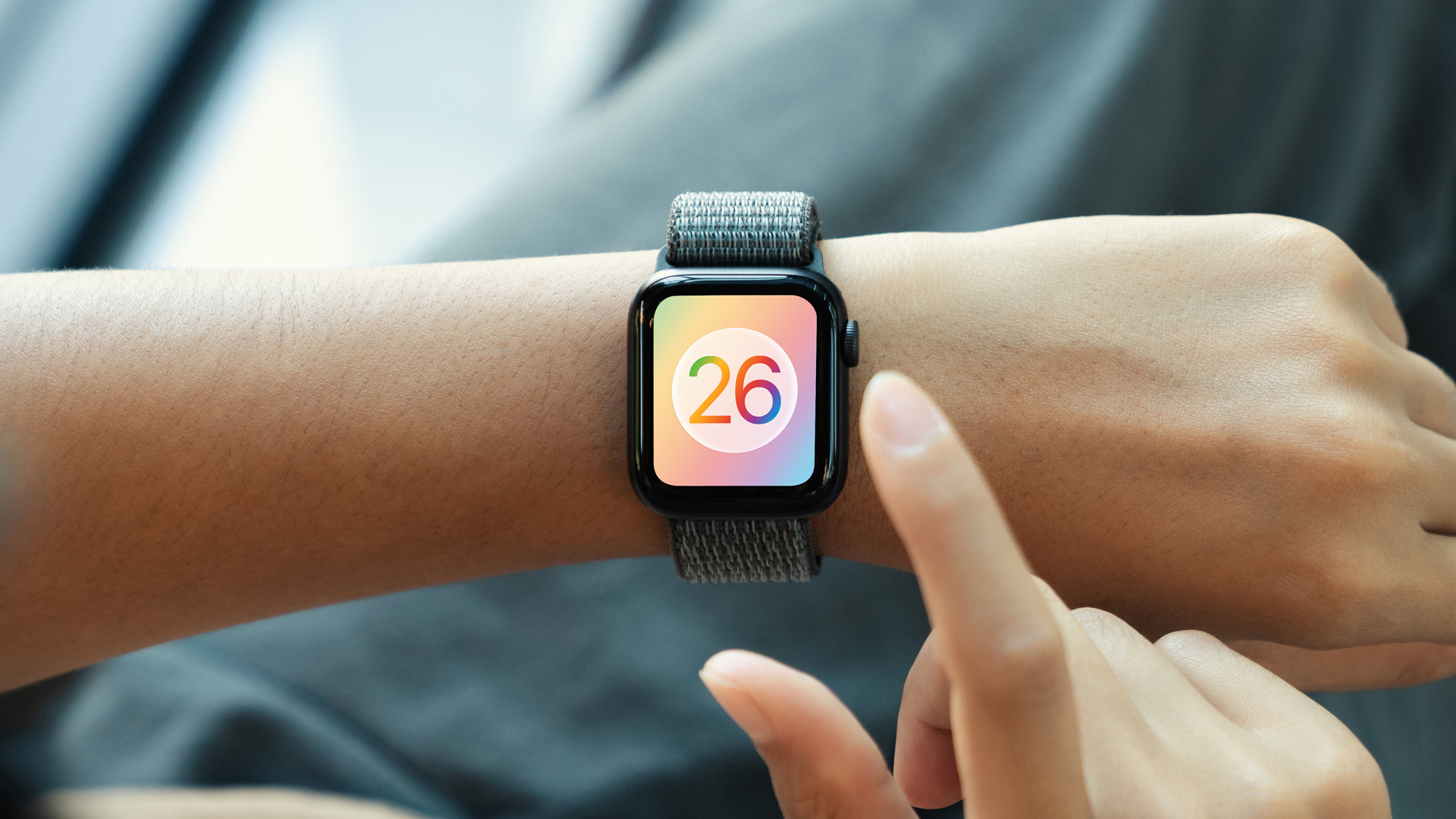 A render of the watchOS 26 logo on an Apple Watch.