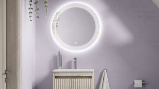 A lilac bathroom with a large mirror illustrating paint color ideas for bathrooms
