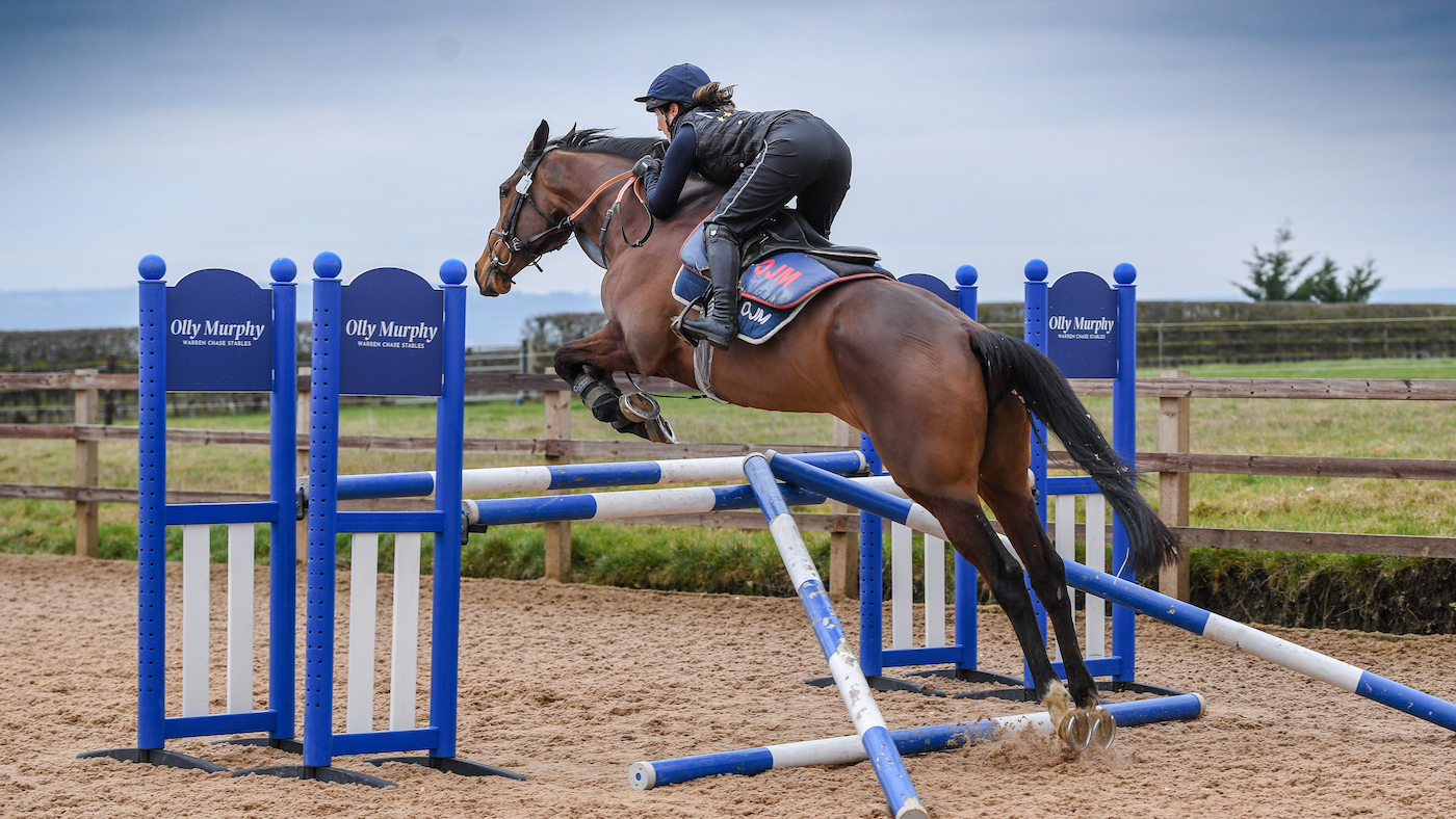 Laura Collett jump-schooling a racehorse