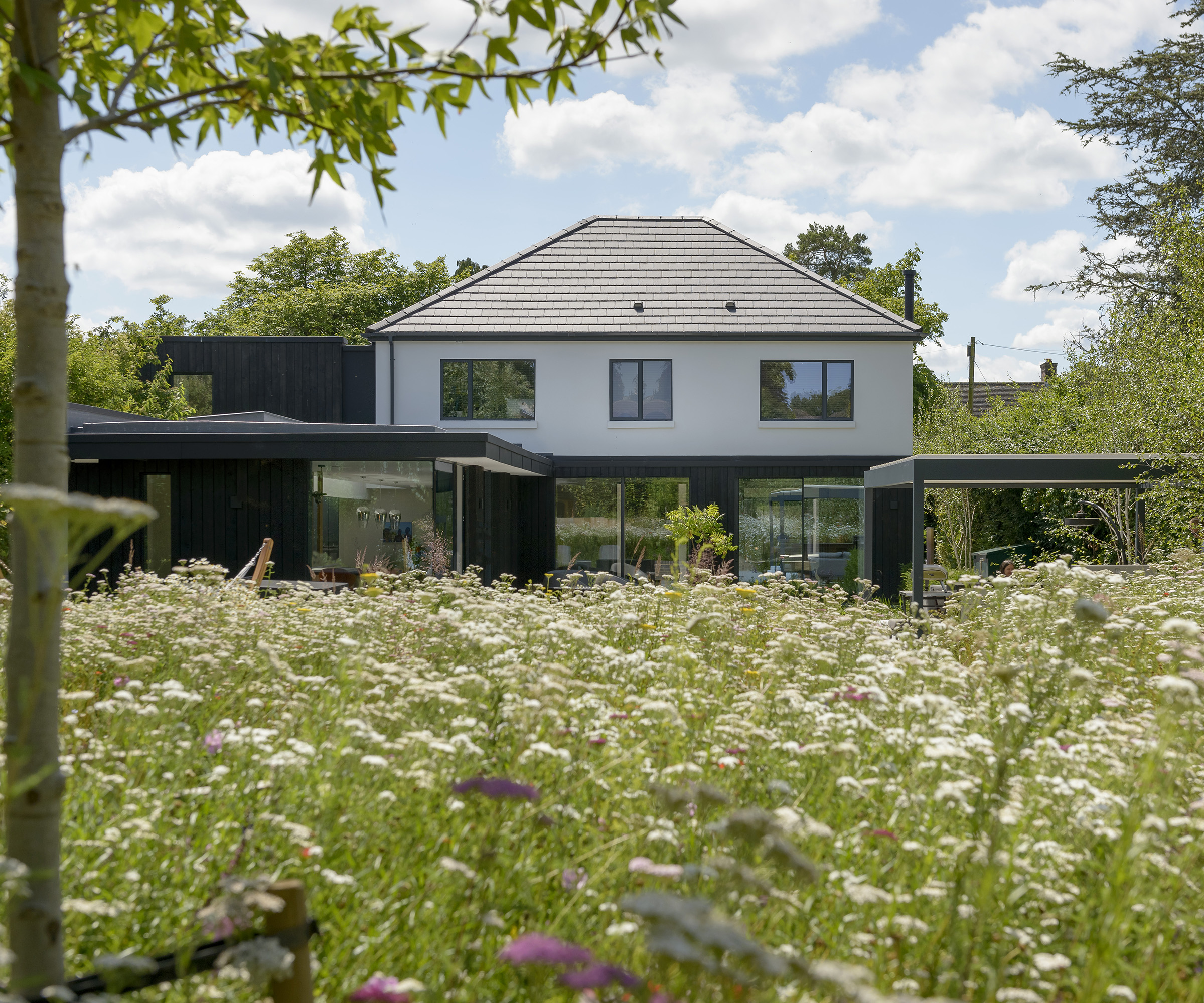 The rear exterior of a contemporary extension to a 1930s detached home