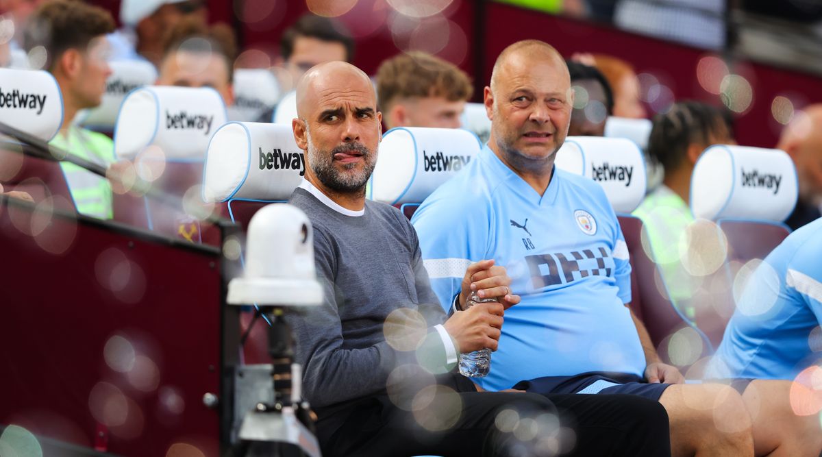 Pep Guardiola, manager of Manchester City, looks on during the Premier League match between West Ham United and Manchester City at London Stadium on August 07, 2022 in London, England