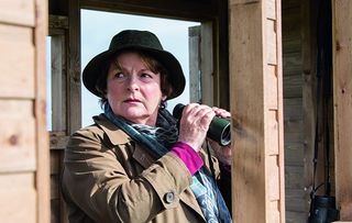 Vera season 14: Brenda Blethyn as the titular detective, holding binoculars
