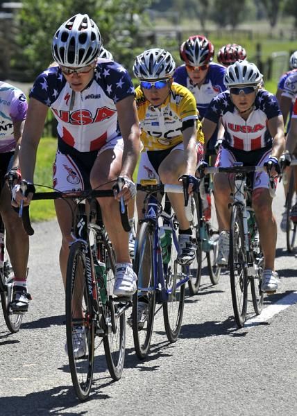 Amber Neben is protected by her USA National Team teammates.