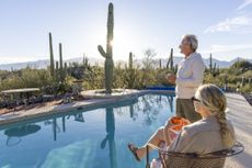 Couple sitting by the pool