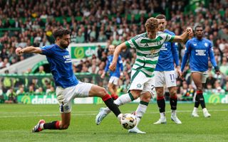 GLASGOW, SCOTLAND - SEPTEMBER 01: Celtic&#039;s Arne Engels (R) and Rangers&#039; Robin Propper in action during a William Hill Premiership match between Celtic and Rangers at Celtic Park, on September 01, 2024, in Glasgow, Scotland. (Photo by Ross MacDonald/SNS Group via Getty Images)