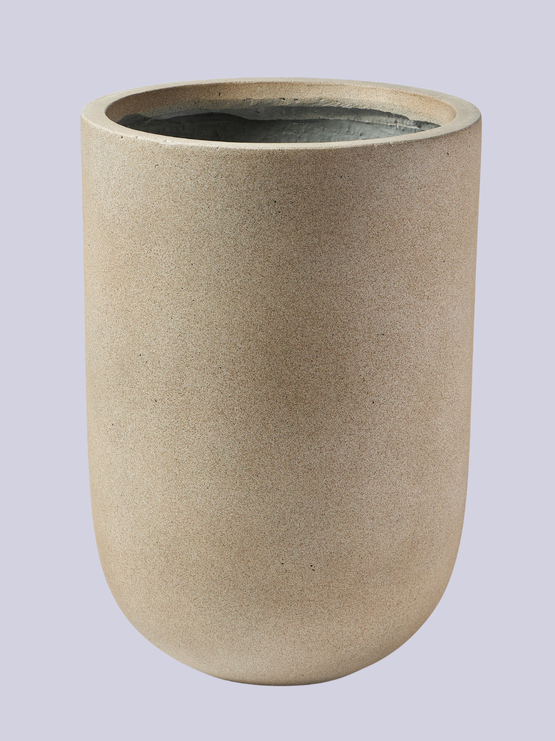 A smooth round beige planter from Westwing