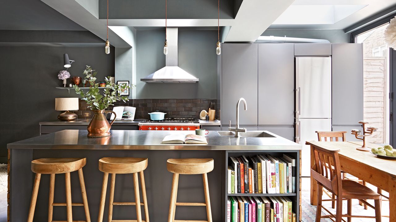 Dark gray kitchen cabinets with kitchen island and bar stools