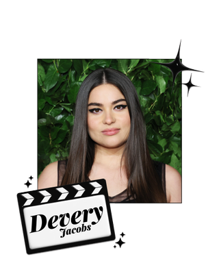 Devery Jacobs in front of a green wall
