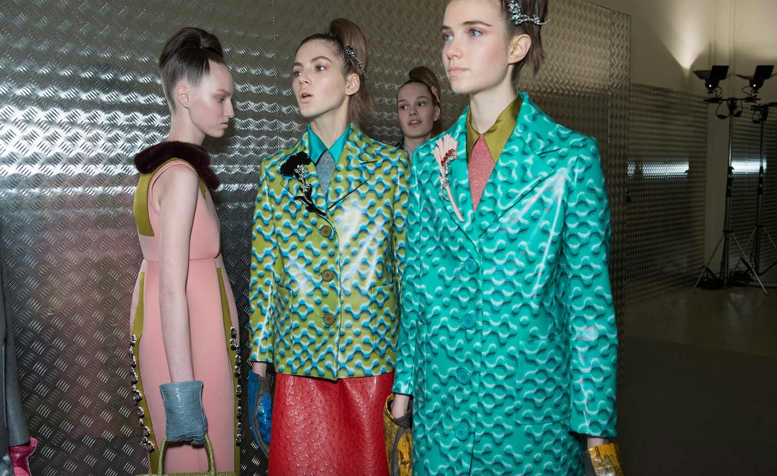 Plex and crystal floral corsages finished jacket lapels or high-combed hairstyles