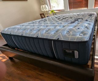 Side view of the Stearns & Foster Estate Mattress against a white wall.