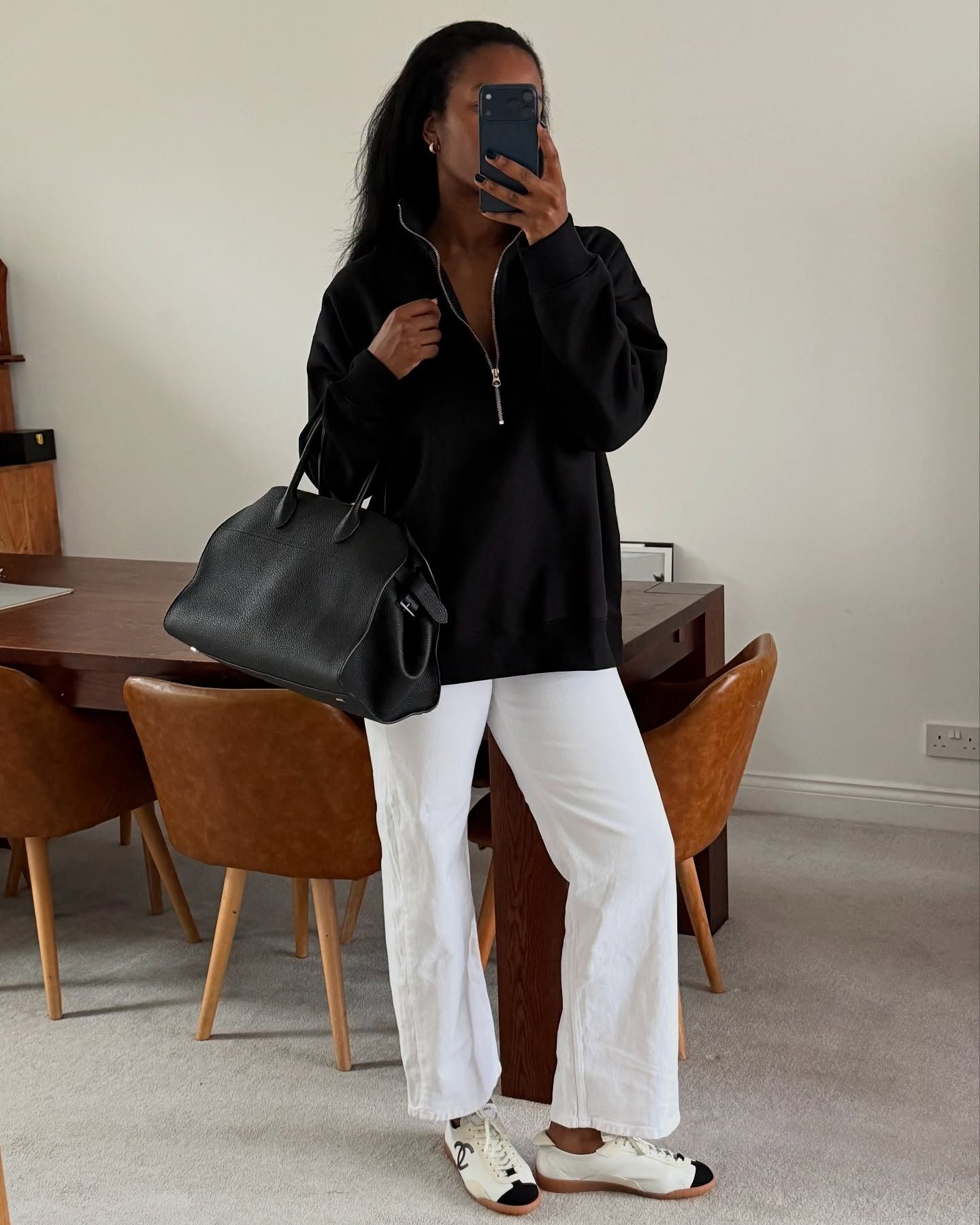 Fashion influencer wearing a quarter-zip pullover