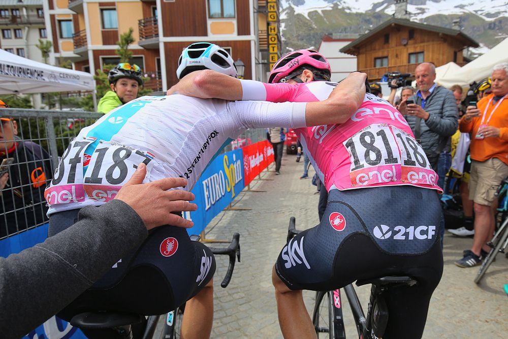 Chris Froome and teammate Wout Poels celebrate after the Giro's stage 20