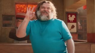 Jack Black stands with a wild face of happiness in A Minecraft Movie.