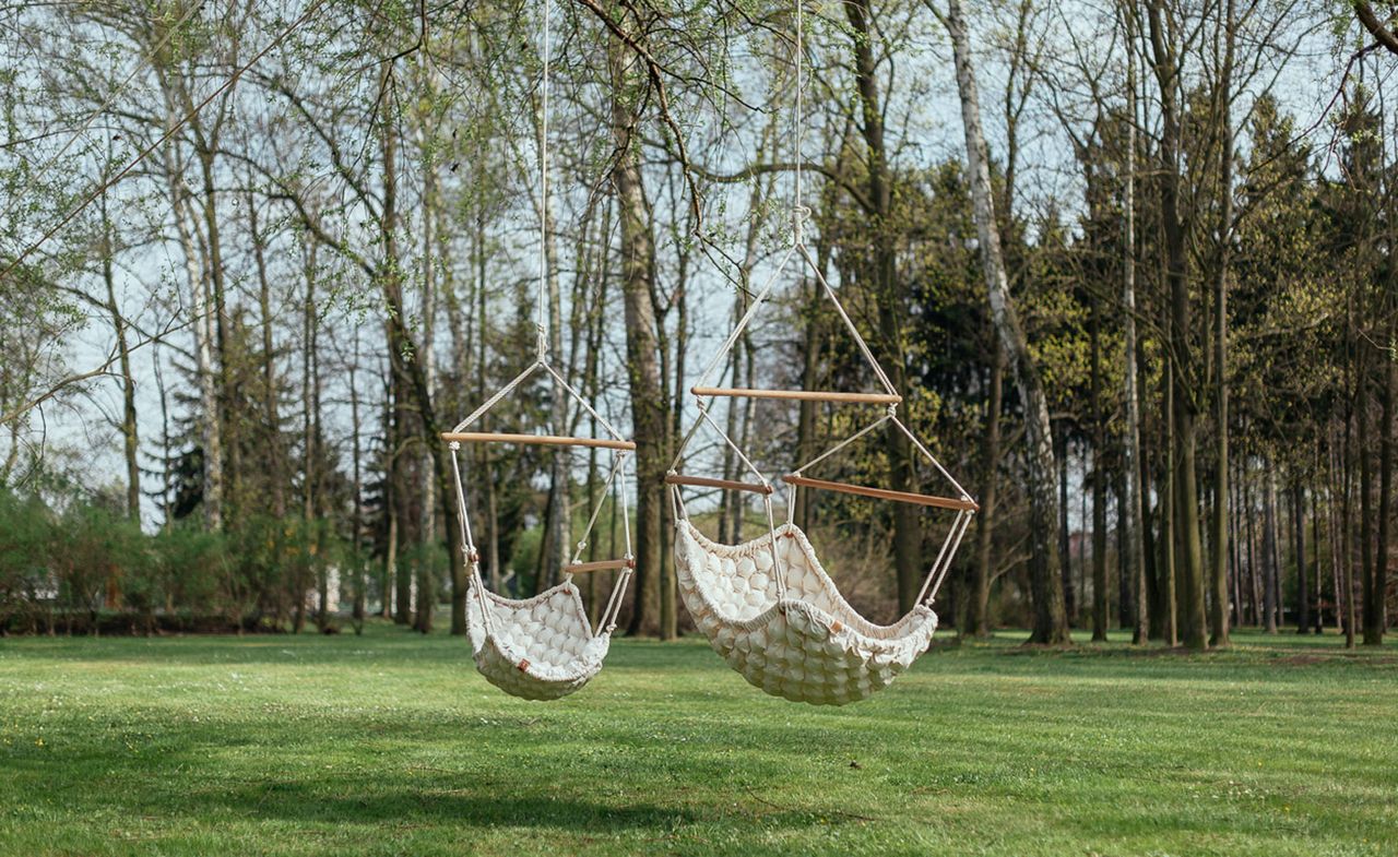 Padded cream seat in the style of a hammock