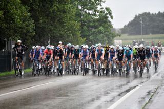 The pack rides during the stage 17 of the Vuelta a Espana, a 141,5 km race between Arnuero and Santander, on September 4, 2024. (Photo by ANDER GILLENEA / AFP)