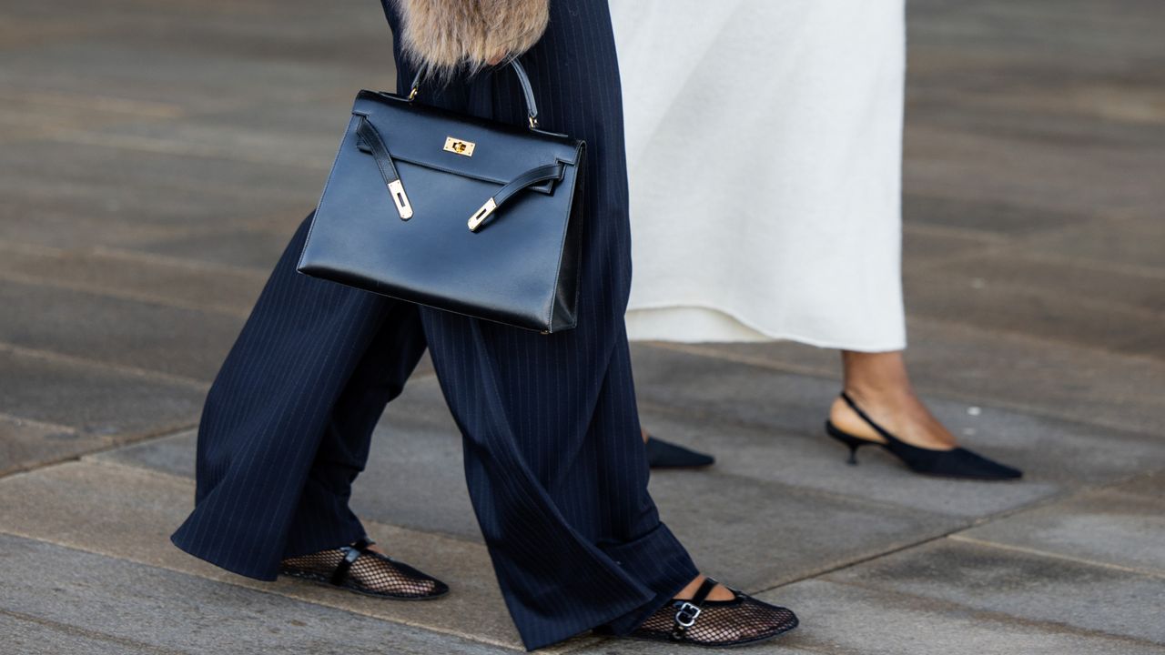 Two women walk at fashion week wearing mesh Reformation flats to illustrate a guide to the best mesh flats of 2024